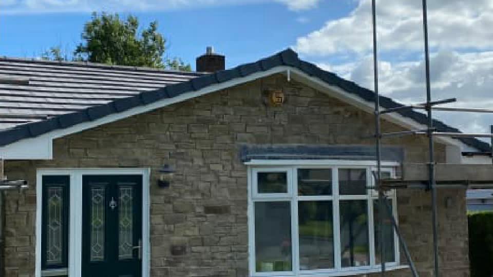 W & H Roofing van and crew on a roofing project in Burnley, Lancashire